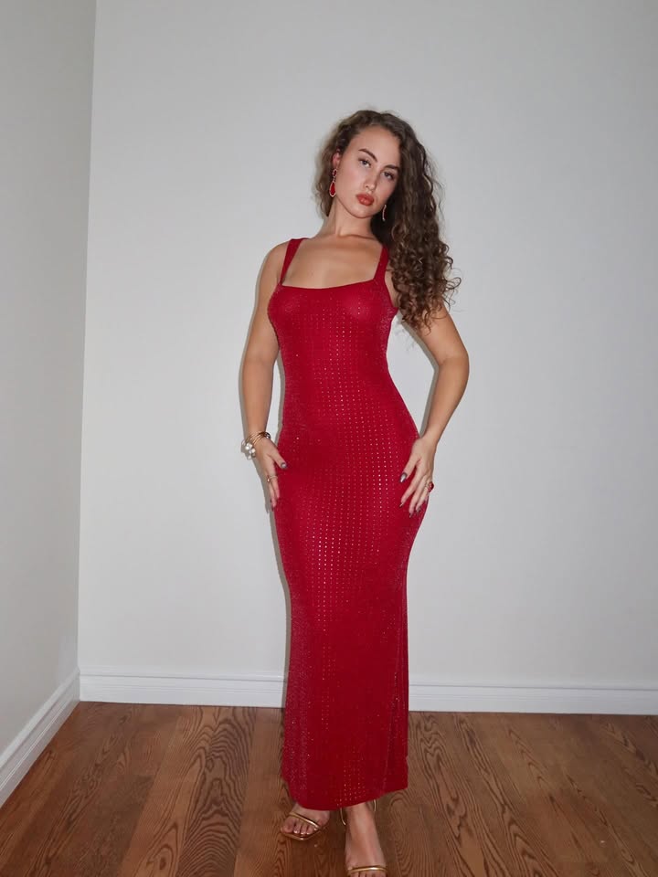 May be an image of dress and text