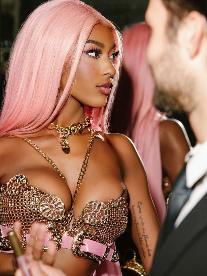 May be an image of one or more people, makeup, fishnet stockings and text