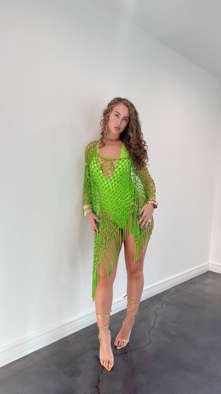 May be an image of fishnet stockings, dress and text