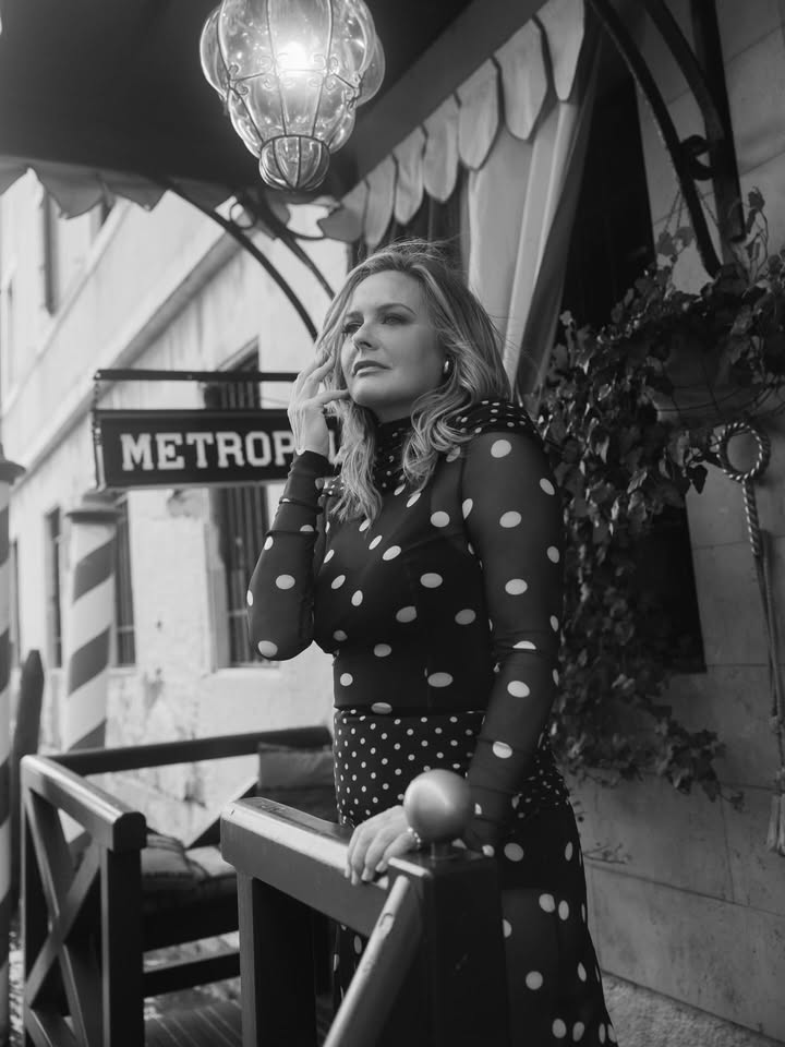 May be a black-and-white image of headscarf, fishnet stockings and text