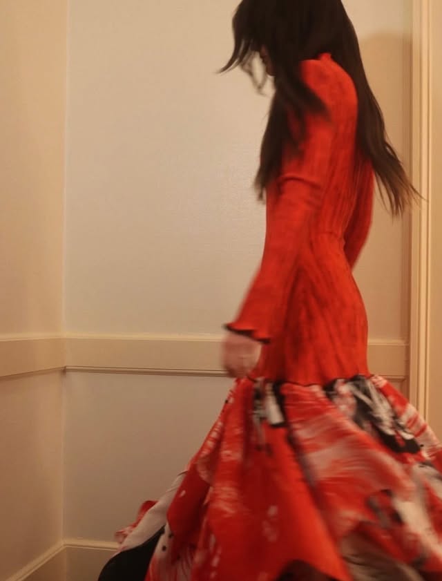 May be an image of dancing, dress and text