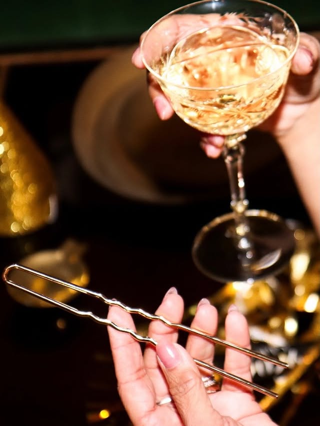 May be an image of champagne, cocktail shaker, chopsticks, tongs, strainer and text