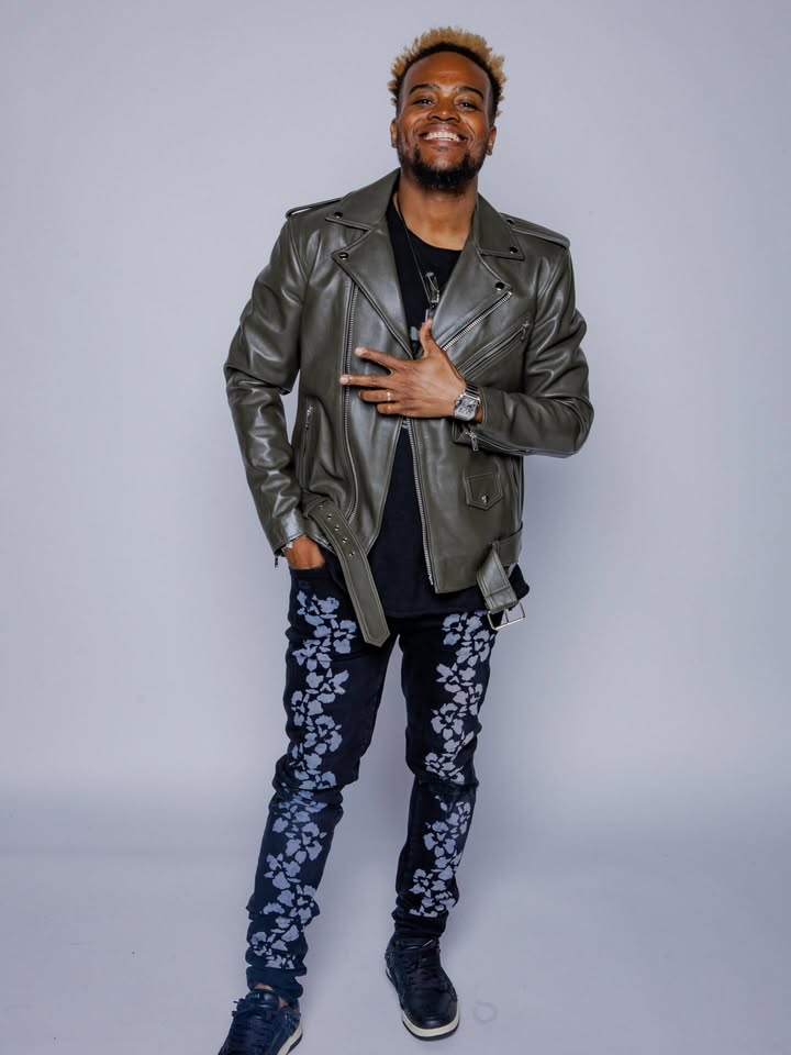 May be an image of leather, wrist watch, flight jacket, blazer and text