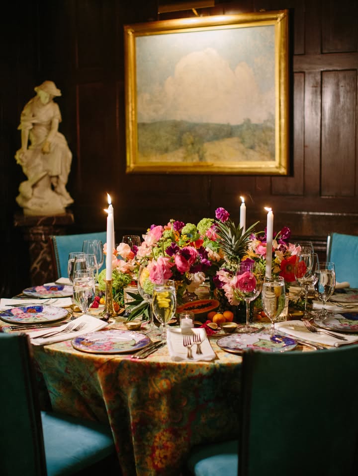 May be an image of candle holder, table, dining table, tablecloth, chinaware and text