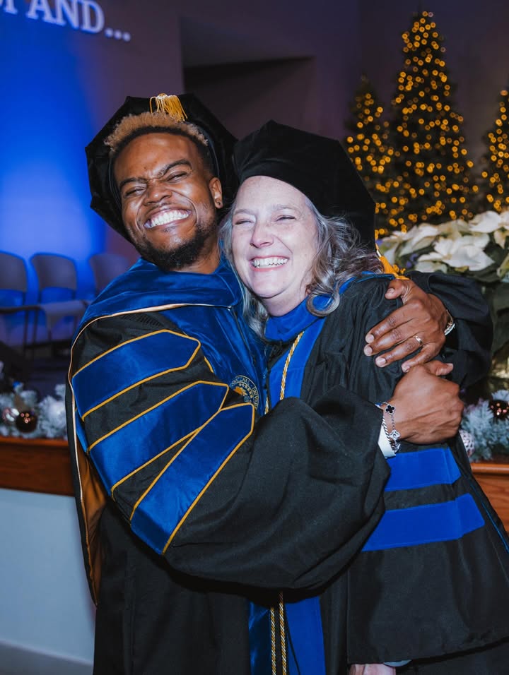 May be an image of smiling, microphone and text