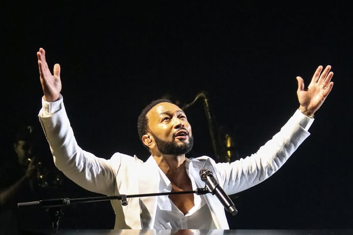 May be an image of microphone, tambourine, concert and text