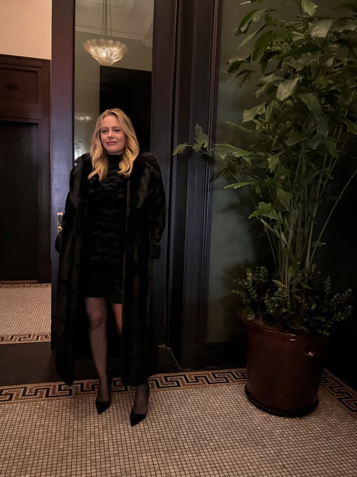 May be an image of sable coat and text