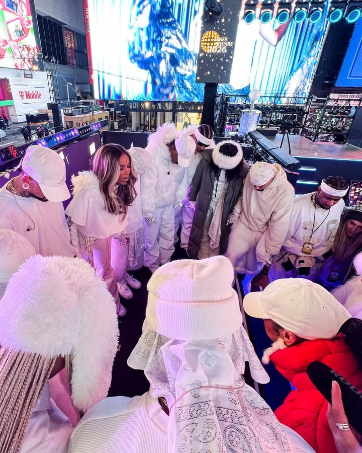 May be an image of headdress, costume and text