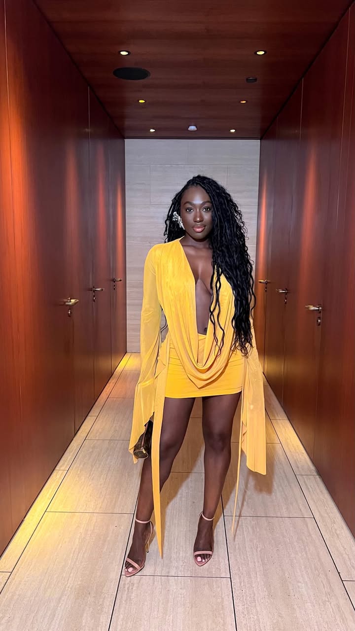 May be an image of one or more people, dress, sundress and text