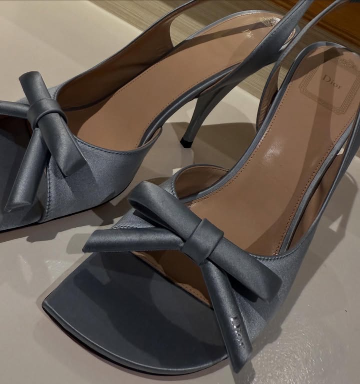 May be an image of sandals, bow, slingback shoes, high-heeled shoes and text