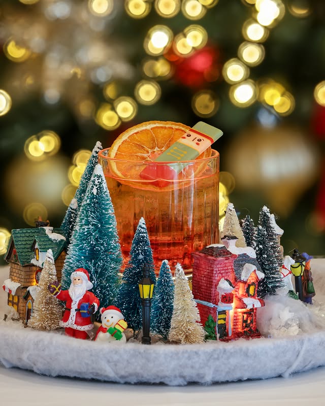 May be an image of drink, christmas tree, snowman, tinsel and text