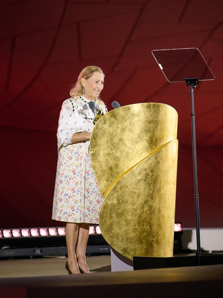 May be an image of one or more people, microphone and text