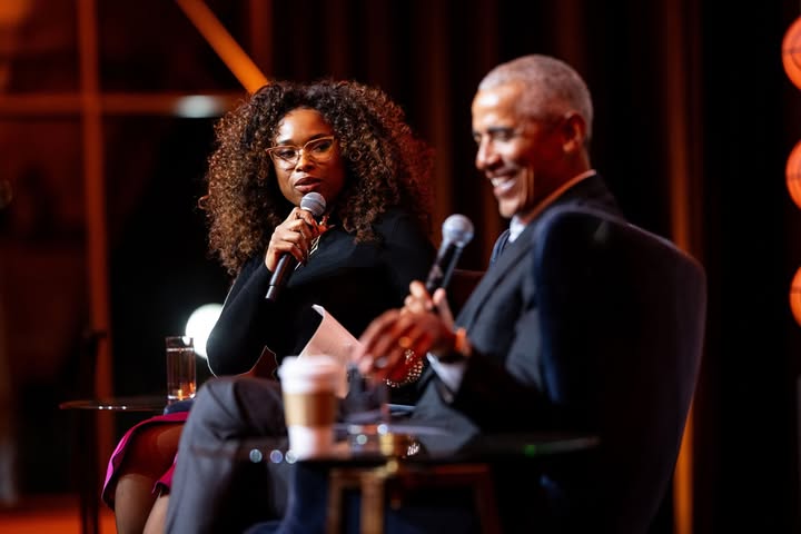 May be an image of one or more people, microphone and text