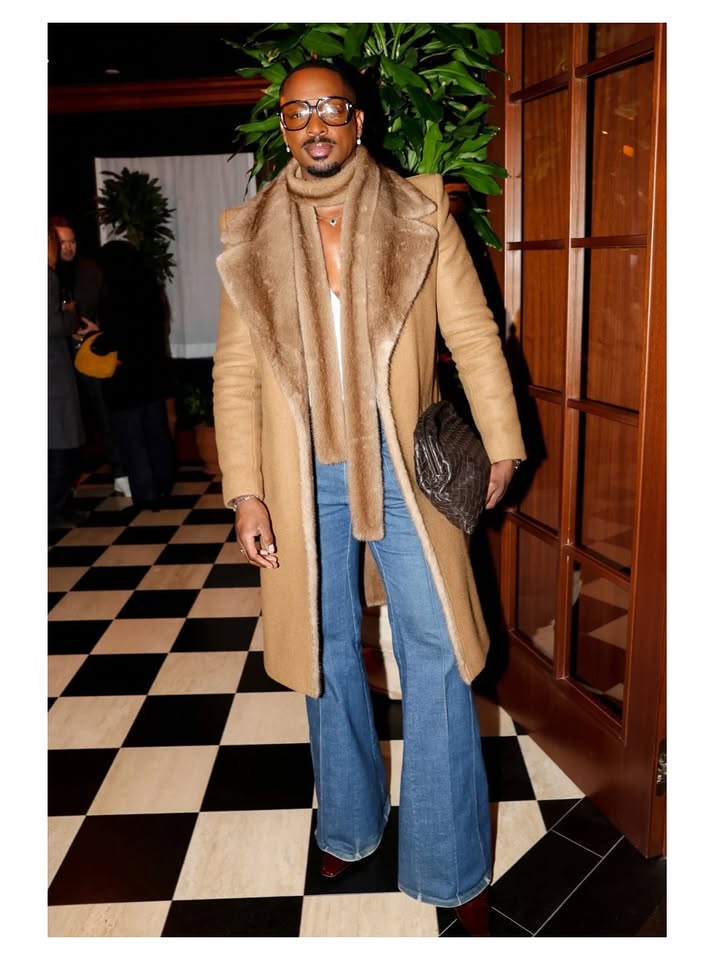 May be an image of sable coat, overcoat and text