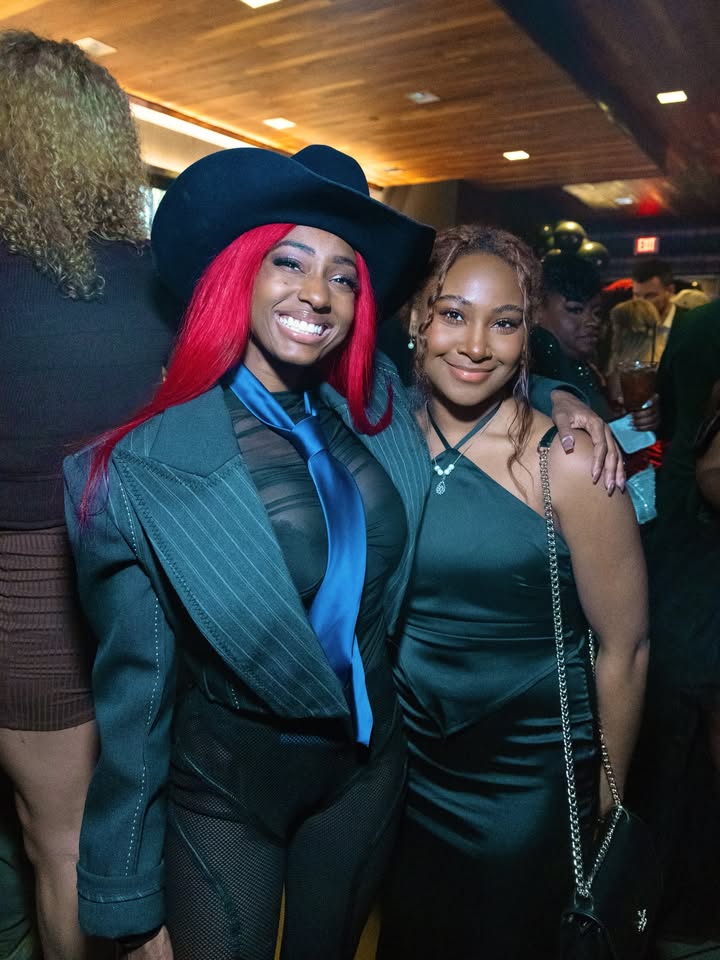 May be an image of one or more people, bowler hat, costume and text