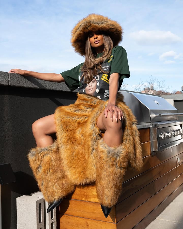 May be an image of one or more people, makeup, fur coat, headdress, headscarf and text