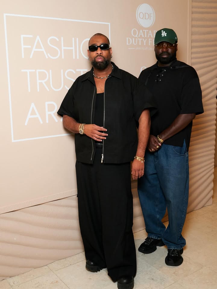 May be an image of standing, eyewear, magazine and text