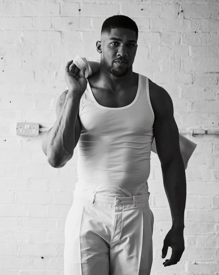 May be a black-and-white image of one or more people, biceps, sportswear and text