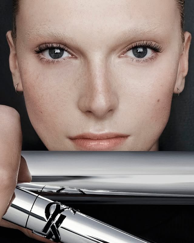 May be an image of one or more people, eyeliner, lipstick, makeup, fragrance, perfume, cosmetics and text