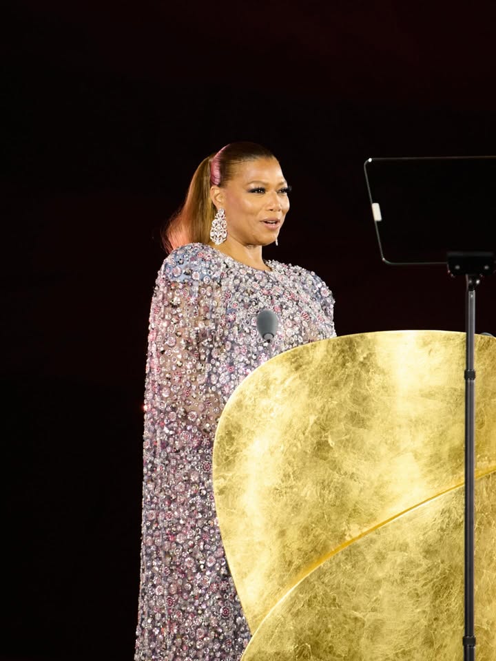 May be an image of one or more people, dress, microphone, tambourine and text