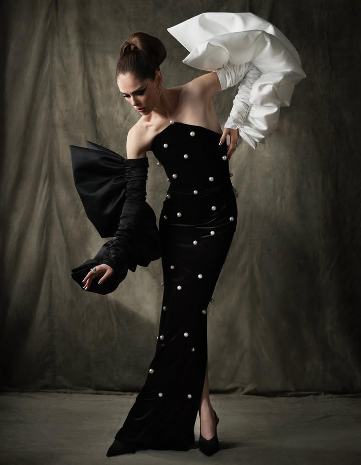 May be an image of dress, gown and text