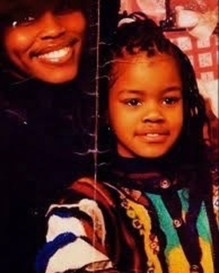 May be an image of one or more people, braids, turtleneck and text