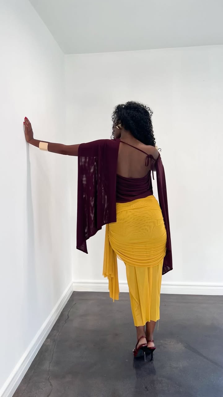 May be an image of miniskirt and text