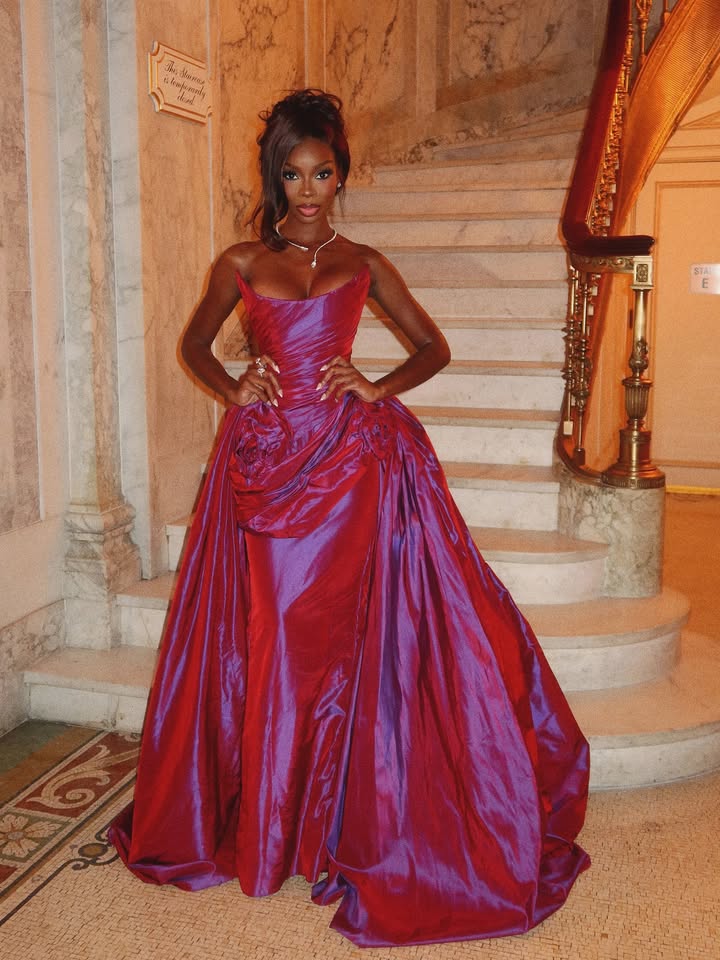 May be an image of dress, gown and text