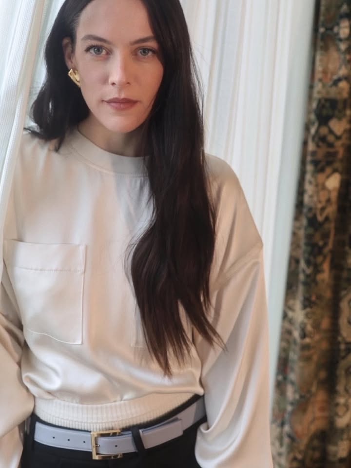 May be an image of top, turtleneck and text