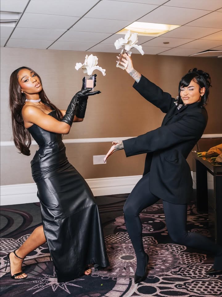 May be an image of sword, costume and text