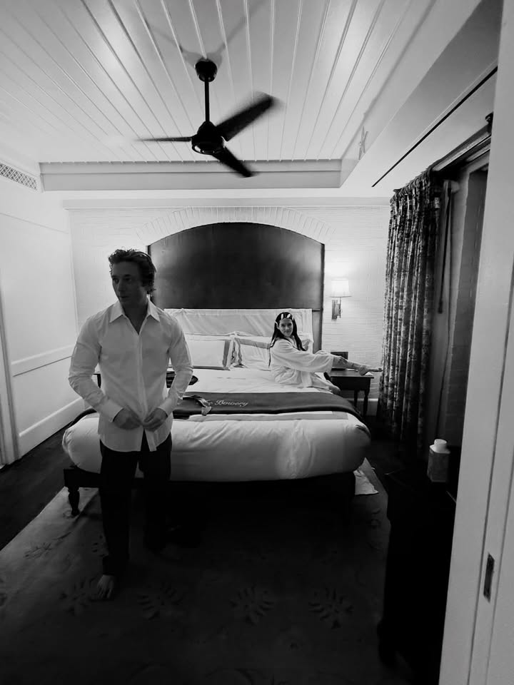 May be a black-and-white image of one or more people, bed, bedroom, hallway and text