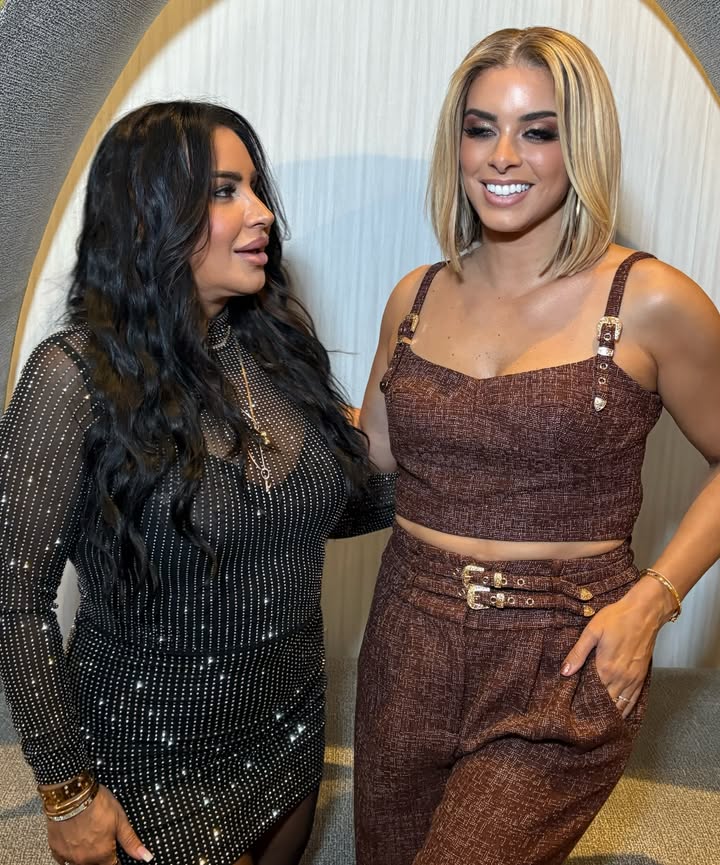 May be an image of one or more people, makeup, jumpsuit and text