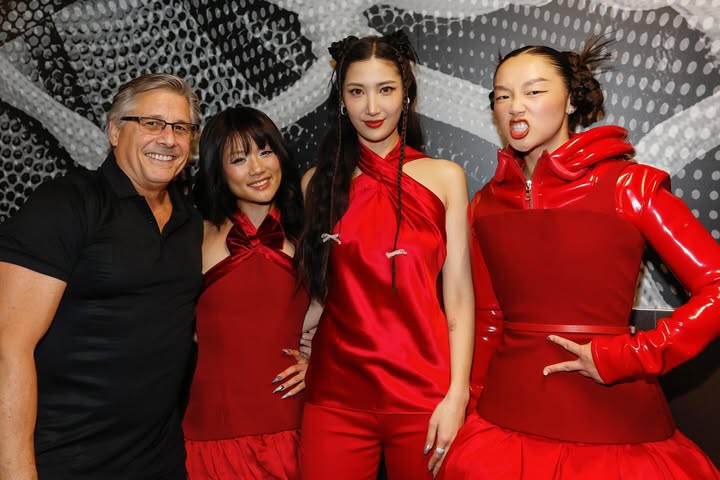 May be an image of one or more people, costume and text