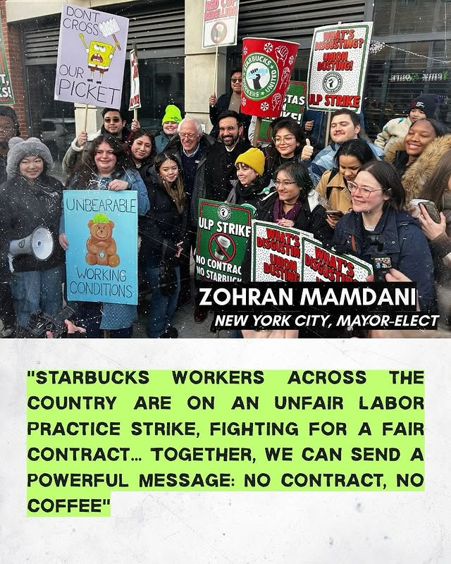 May be an image of standing, poster and text that says 'DONT CROSS 99 OUR PICKET ABUCKS 質だIRS สานน 用9 TAS WPSTRIKE UNBEARABLE ULP STRIKE WORKING CONDITIONS NO CONTRAC MO HO STARRIICM ZOHRAN MAMDANI NEW YORK CITY, MAYOR-ELECT "STARBUCKS WORKERS ACROSS THE COUNTRY ARE ON AN UNFAIR LABOR PRACTICE STRIKE, FIGHTING FOR A FAIR CONTRACT... TOGETHER, WE CAN SEND A POWERFUL MESSAGE: NO , N COFFEE"'