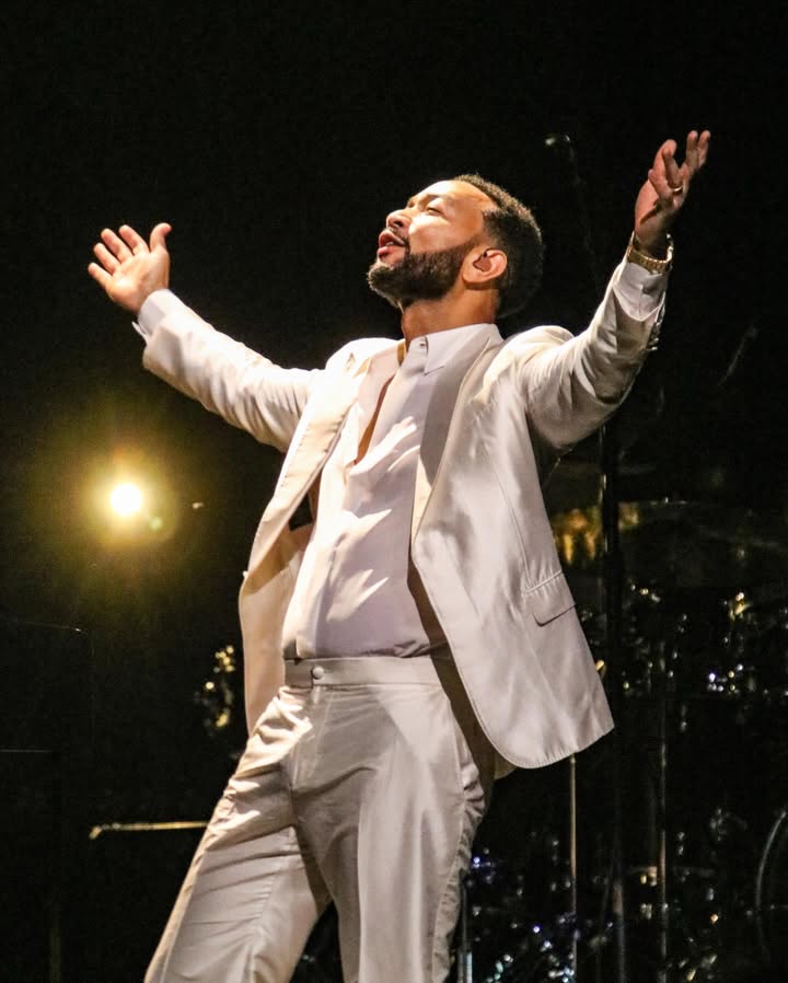 May be an image of microphone, concert and text