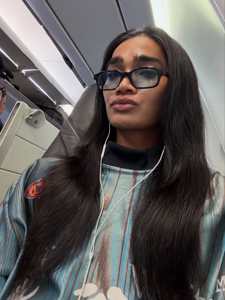 May be a selfie of one or more people, hair, turtleneck, sunglasses and text