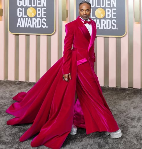 May be an image of suit, dinner jacket, gown and text that says 'GULDEN GLOBE GL BE AWARDS. ULDEN LOBE BE ARDS. ®'