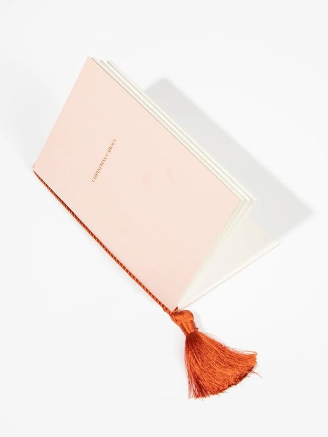 May be an image of book, diary, tassel and text