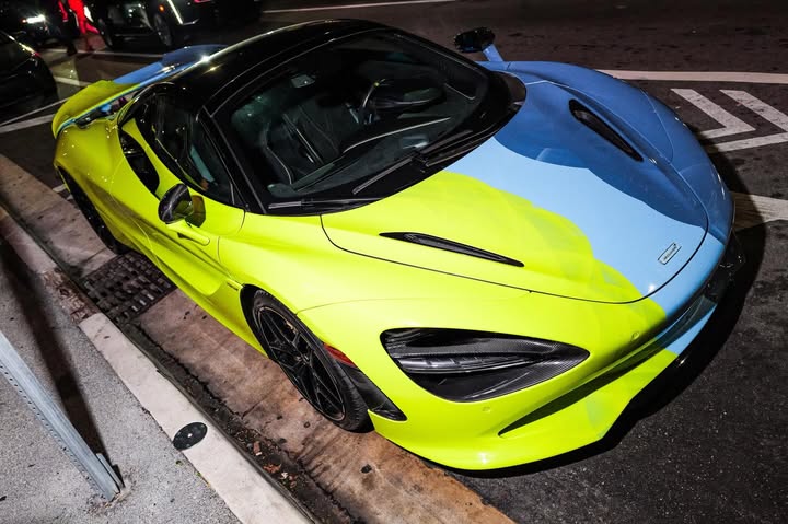 May be an image of race car, wheel and text