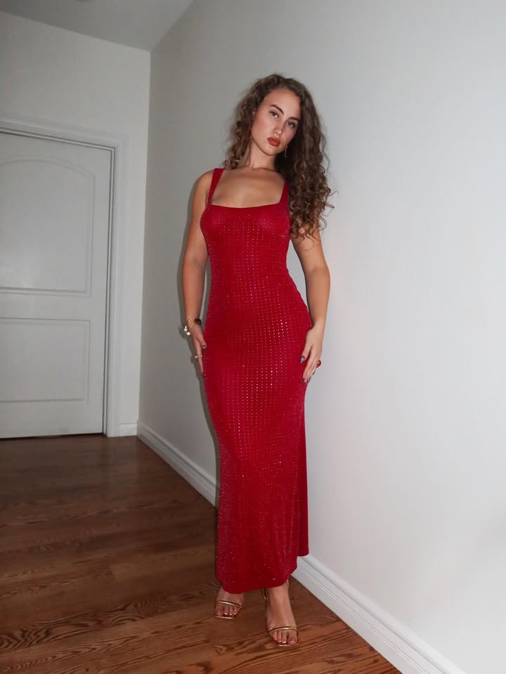 May be an image of dress and text