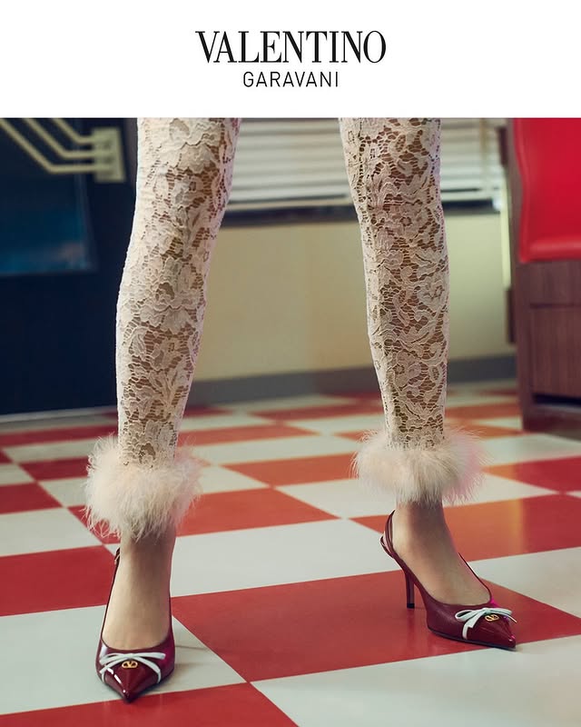 May be an image of one or more people, makeup, fur, slingback shoes, tights, high-heeled shoes, fishnet stockings and text