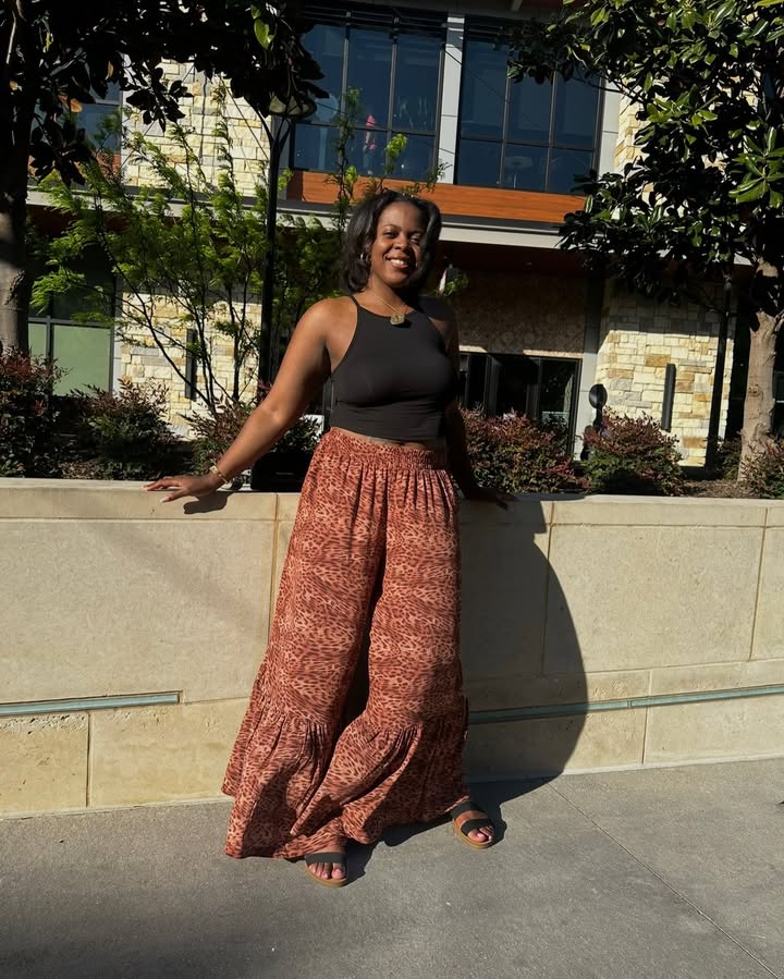 May be an image of one or more people, skirt and text