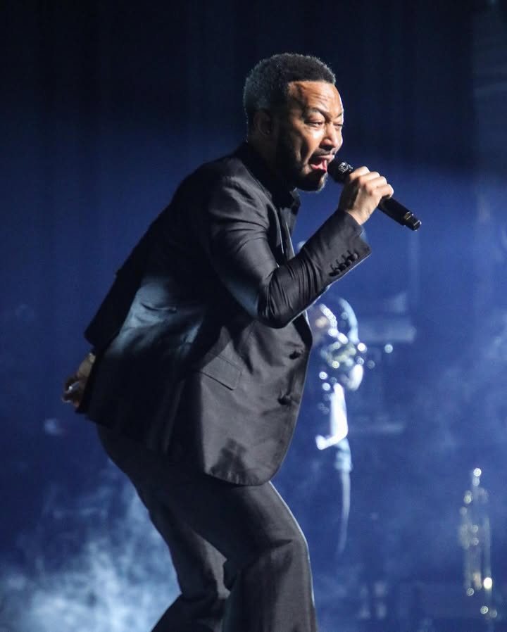 May be an image of microphone, concert and text