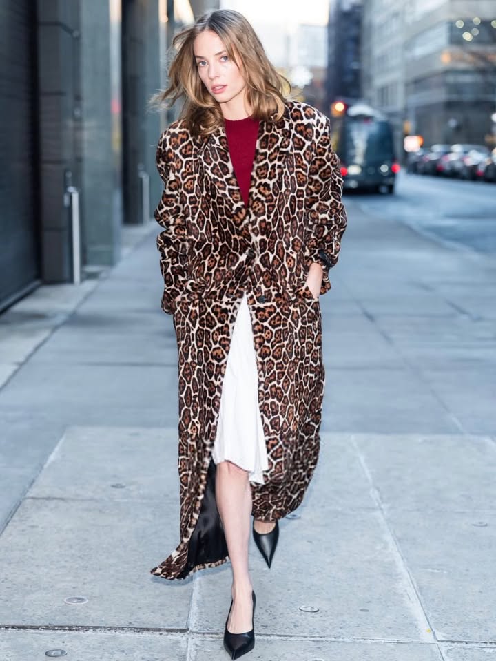 May be an image of fur coat, overcoat, robe, jacket and text