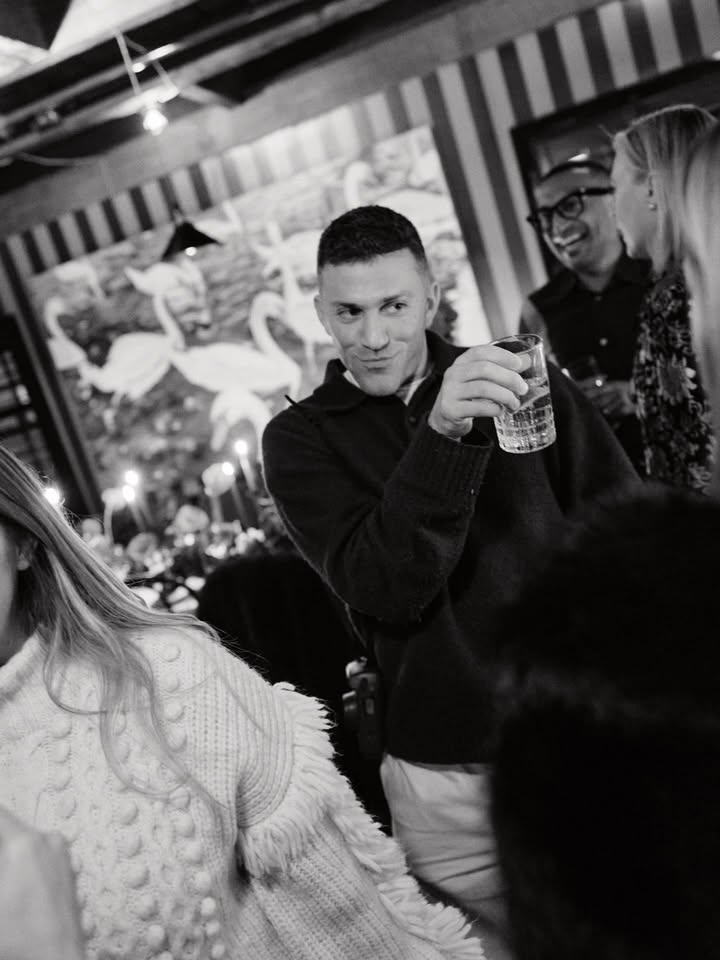 May be a black-and-white image of one or more people, drink, night and text