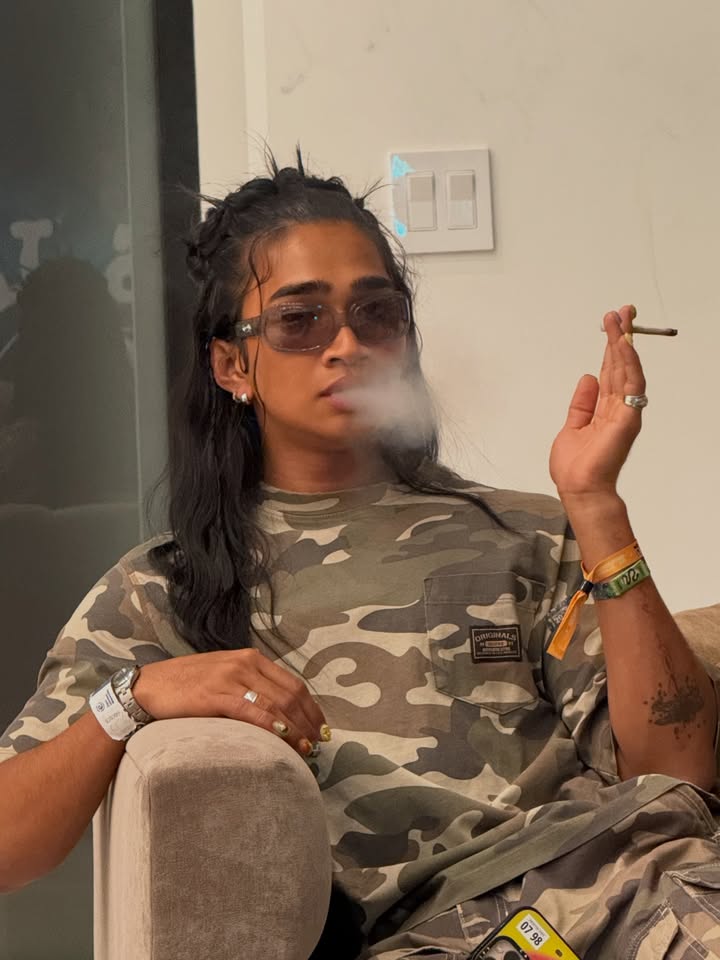 May be an image of smoking, lighter, eyewear, cigarette, cigar, herb and text