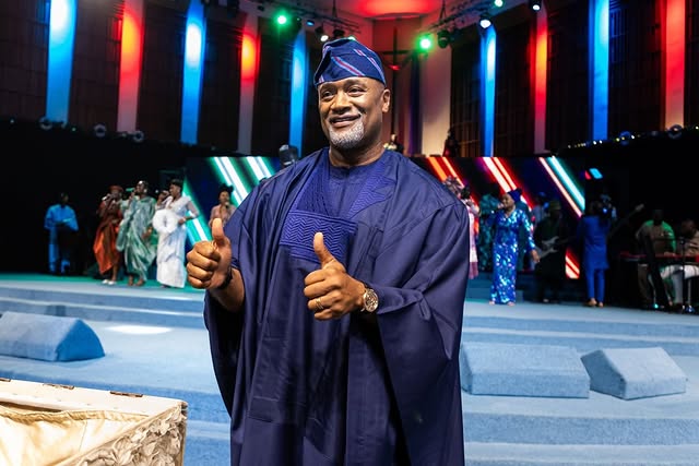 May be an image of one or more people, dais and text