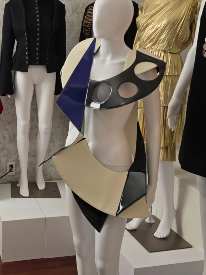 May be an image of mannequin and text