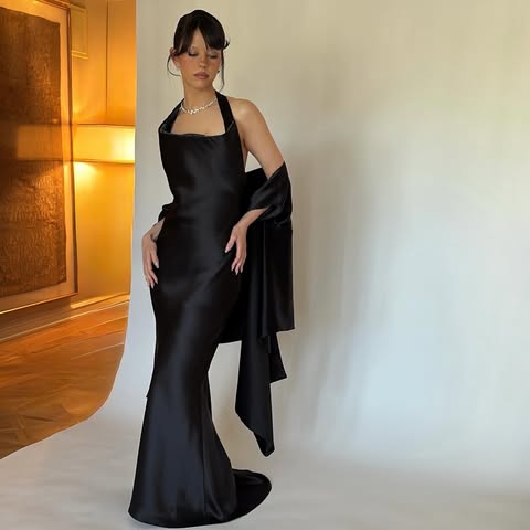 May be an image of gown, dress and text