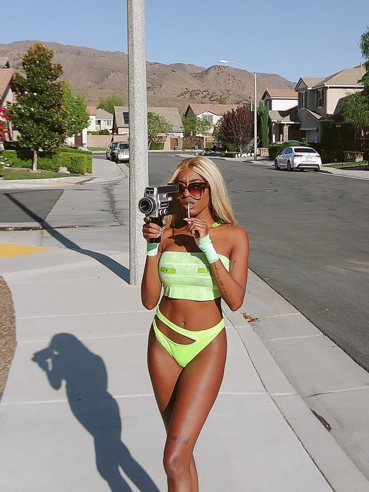 May be an image of fishnet stockings and palm trees